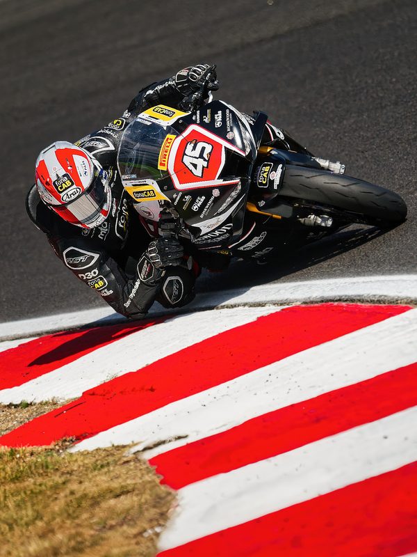 Superbike racing: Scott Swann on the No. 45 bike over red and white kerbs, 2026