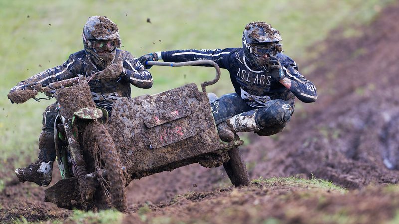 Sidecar motocross: mud-covered driver and passenger, Wakes Colne