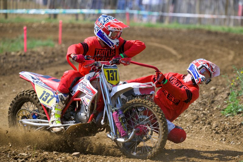 Sidecar motocross: the red No. 137 outfit cornering in dust, Wakes Colne