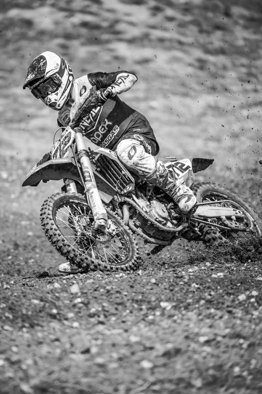 Motocross: black and white image of a solo rider cornering, Wakes Colne